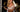 Bonnie Blue with her tongue out holding Fleshlight in one hand and champagne in the other wearing white lingerie with her 