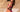 Riley Reid wearing a two piece pink bathing suit with the word "Vixen" on the trim