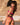 Riley Reid wearing a two piece pink bathing suit with the word "Vixen" on the trim