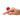 Hand wearing a red rose-shaped finger vibrator on a white background