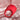 Red silicone ring finger vibrator with measurements and product features on a pink fabric background