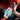 Hand holding Power Suck Sucking & Vibrating Masturbator with digital display against a fiery background