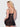 Woman wearing a Black lace nightgown against a white background