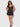 Woman wearing a Black lace nightgown against a white background