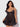 Woman wearing a Black lace nightgown against a white background