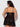 Woman wearing a Black lace nightgown against a white background