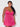 Woman wearing a pink lace nightgown against a white background