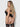 Woman wearing black lingerie with sheer panels on a plain background