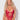 Woman wearing a red lace lingerie set against a white background