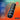 Black Arcwave Orbit Rotating Masturbator with features highlighted on a colorful background