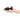 Black butt plug held in a hand on a white background