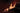 Woman in lingerie lying on a couch with a dark background