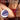 Person using The Tickler Vibrating Silicone Tickler on another person with 'Tickle & Tease' branding.