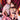 Man and woman in lingerie sitting together using sei mio restaint set with tattoos visible
