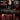 A black Master Series padded travel shoulder strap bag shown being carried over a red suitcase in a dimly lit interior. The image includes text callouts reading 'PERFECT FOR TRAVEL,' '3 SECURE CLIPS,' and 'PADDED SHOULDER STRAP' with adjustment details, plus the Master Series logo.