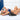 Woman in blue lingerie lying on Liberator Wedge 24 Inch in Black against a white wall.