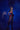 Model wearing Black Widow Adult Halloween Costume with red accents against a dark blue background