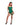 Woman wearing a green costume with leaf details on a white background