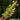 Eyegor Thrusting and Vibrating Silicone Dildo with glowing green eyes held by a hand against a dark background.