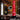 Red silicone dildo with measurement details and 'Creature Cocks' branding on a desert landscape background.