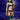 Person in green lingerie with Creature Cocks Tenta Dildo with Harness, set against a purple underwater background.