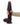 Hand holding a dark brown silicone dildo against a white background