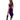 Woman wearing a colorful costume with a purple skirt on a white background