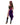 Woman wearing a colorful costume with a purple skirt on a white background