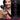 Woman holding a black handheld wand massager with product features listed on the right.