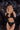 Model wearing Playboy lingerie with a disco ball background
