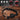 Master Series Forced Silicone Feeding Gag – Locking Ring Gag for Feeding Play and Oral Control Scenes with measurement details on a wooden surface, featuring Master Series branding.