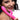 Woman holding a pink Frisky Rebel Rabbit 21X Rabbit Vibrator