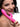 Woman holding a pink Frisky Rebel Rabbit 21X Rabbit Vibrator