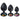 Three black butt plugs with colorful gemstones on a white background