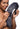 Woman holding a large, fluffy fox tail against a white background