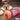 Masturbator with a stylized depiction of a person bound and a product labeled 'X-Rated' on a wooden surface.