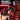 Advertisement for a 'Helmet Humper' product with red and black design, showing dual motor vibrations and features.