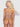 Woman wearing a sheer lingerie set against a white background