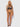 Woman wearing a leopard print lingerie set on a white background