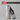 JO Stroker Lube 8oz bottle with a silver Maxtasy stroker on a gray background