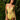 Woman wearing sheer yellow teddy in a forest setting