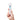 Hand holding a white vibrating massager with blue accents on a white background