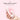 Hand holding a Le Wand Mini Vibe G-Double G-Spot Vibrator with 'Single-Button Control' text on a pink background
