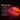 Instructions on how to use LELO Boomerang Premium Double-Ended Vibrator with a blurred red light in the background