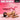 Product advertisement for a pink Piggy Tail Anal Plug with measurements and branding, featuring a model on a pink background.