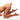 Naked legs with a pink Fluffy Bunny Tail Anal Plug on a white background