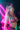 A model wearing pink flocked bunny chaps with a plunge neckline and Playboy logo elastic.