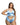 Woman wearing a light blue satin lingerie set on a white background