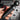 Black detachable wand with remote control held by a hand, featuring text on patterns and speeds.