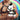 Male model holding White Master Series Prism Pearl Bondage Pony Plushie